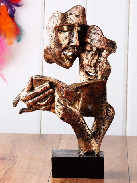 

Ferns N Petals Copper-Toned & Black Reading Book Couple Face Showpiece
