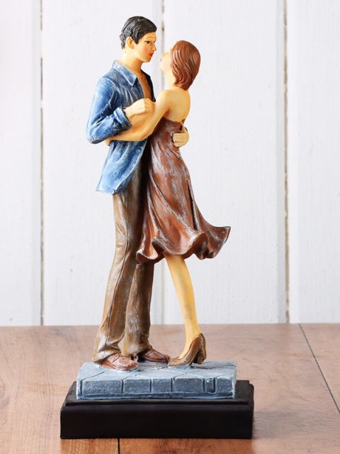 

Ferns N Petals Brown & Yellow Romantic Love Couple Showpiece