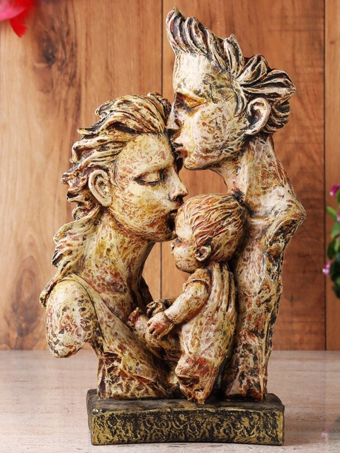 

Ferns N Petals Brown & Yellow Mother & Father Love Statue Showpiece