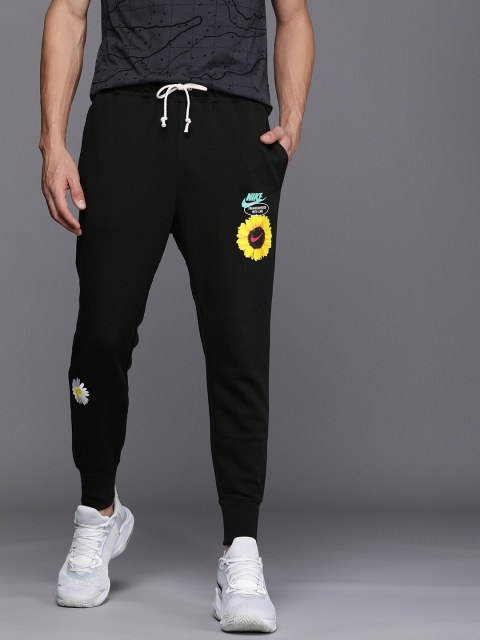

Nike Sportswear Men Navy Blue Graphic Printed Mid-Rise Regular Joggers