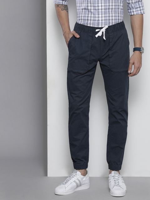 

Tommy Hilfiger Men Navy Blue Solid Mid Rise Joggers Trousers