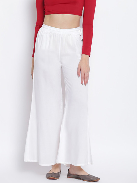 

Lakshita Women White Solid Flared Palazzos
