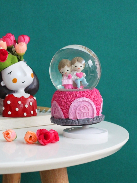 

TIED RIBBONS Pink & White Valentine Couple Rotating With Music Decorative Showpiece