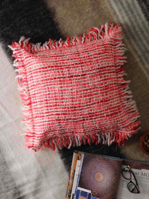 

Amoliconcepts Pink & White Handwoven Fringed Square Cushion Cover
