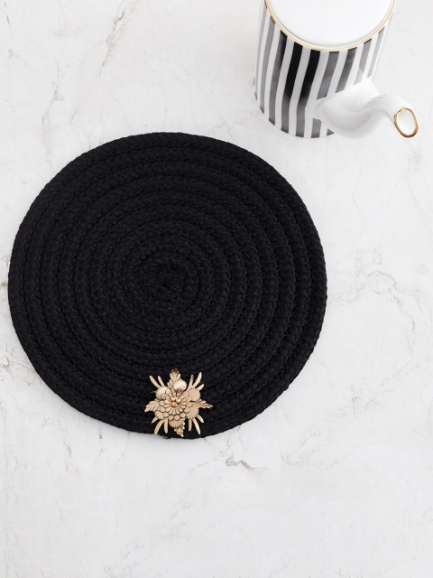 

Home Centre Black Flower Textured Circular Trivet