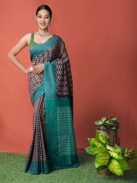 

Unnati Silks Black & Teal Silk Cotton Pochampally Saree