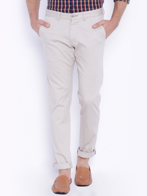

Basics Men Off-White Solid Tapered Fit Chino Trousers