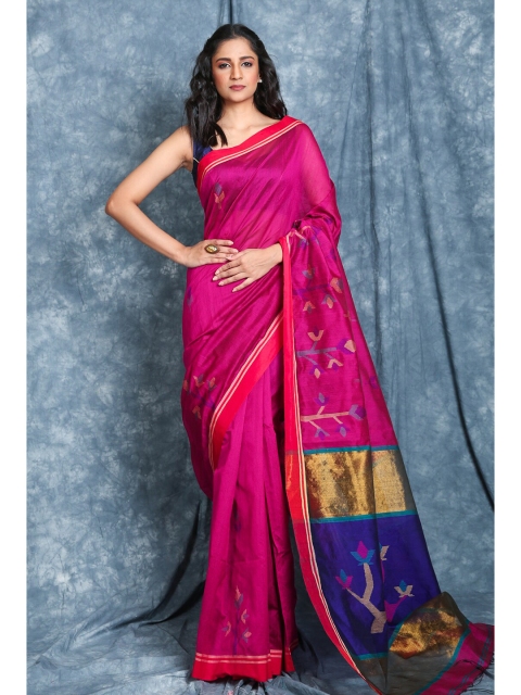 

Charukriti Magenta & Navy Blue Ethnic Motifs Saree