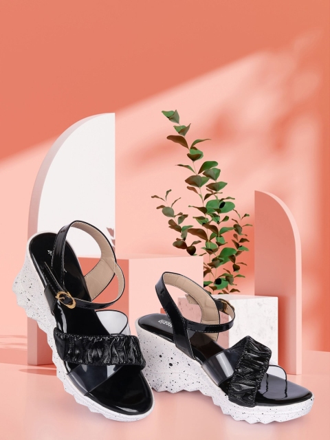 

Alishtezia Black Printed PU Block Sandals with Bows