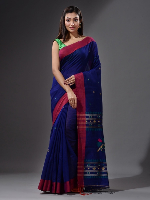 

Charukriti Blue & Magenta Ethnic Motifs Saree