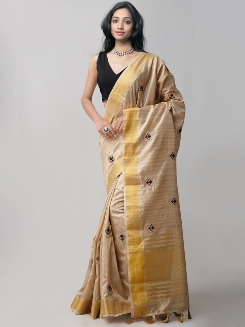 

Unnati Silks Taupe & Gold-Toned Ethnic Motifs Zari Silk Blend Tussar Saree