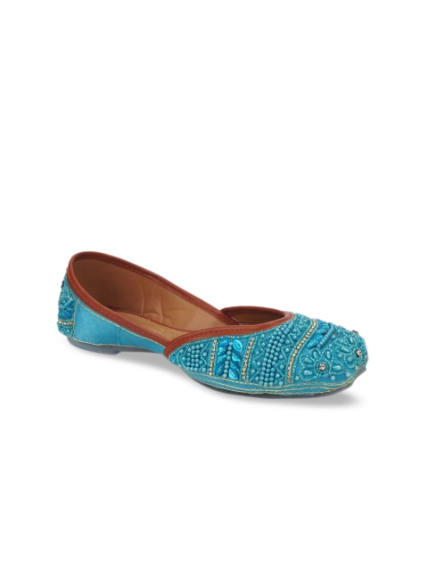 

The Desi Dulhan Women Blue Embellished Leather Ethnic Mojaris