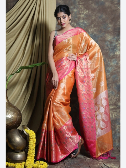

Charukriti Orange & Pink Ethnic Motifs Zari Tissue Saree