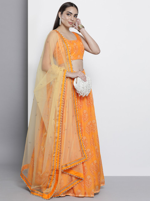 

DRESSTIVE Orange & Beige Printed Semi-Stitched Lehenga & Unstitched Blouse With Dupatta