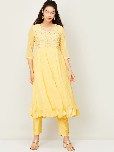 

Melange by Lifestyle Women Yellow Floral Yoke Design Panelled Kurti with Trousers & With Dupatta