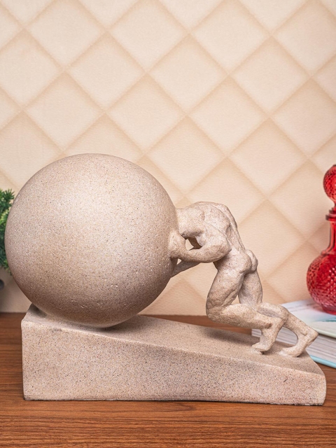 

TIED RIBBONS Beige Man Pushing Earth Abstract Showpiece