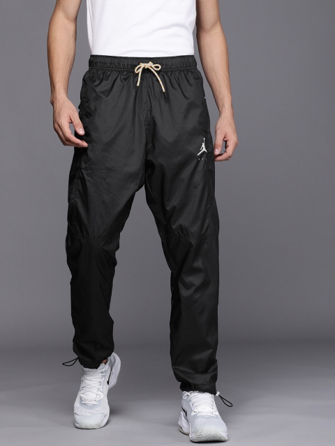 

Nike Sportswear Men Black Checked Mid-Rise Regular Fit Joggers