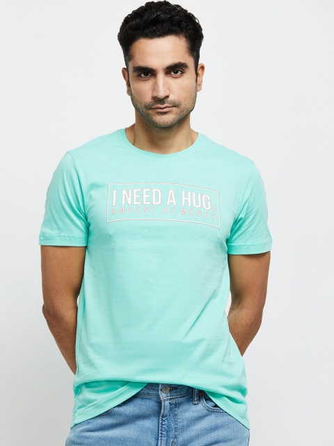 

max Men Blue Typography Printed Applique T-shirt