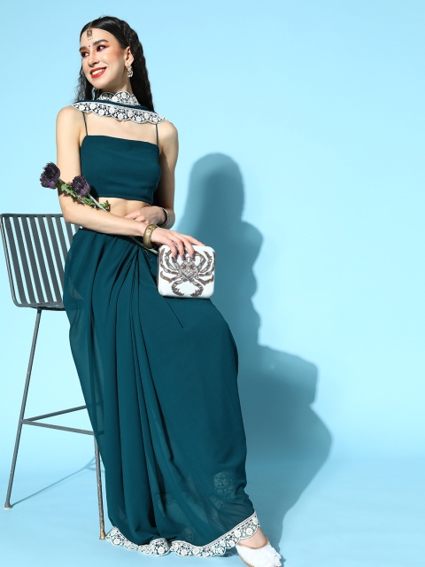 

Inddus Teal Saree with Embroidered border