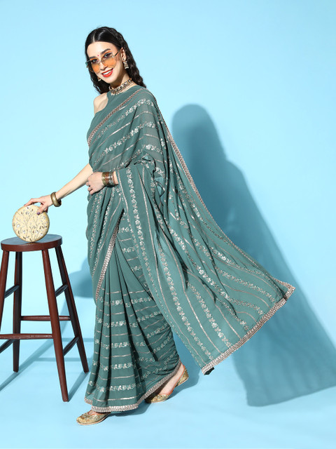 

Inddus Women Green Georgette Floral Saree with Blouse Piece