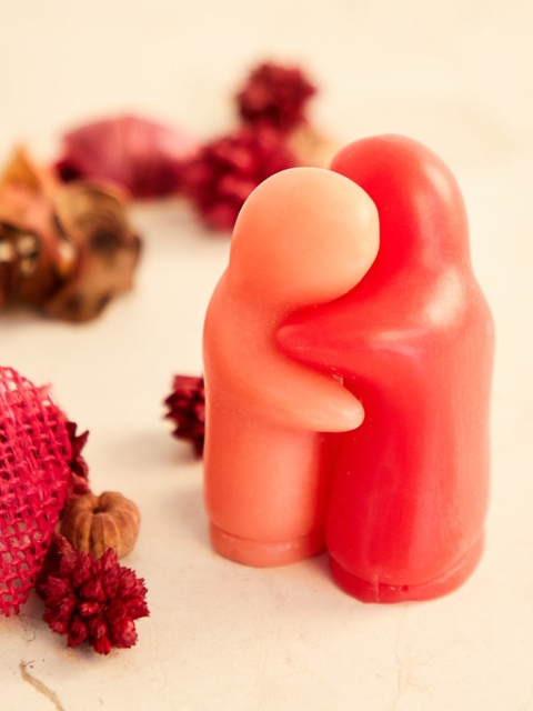 

Home Centre Red & Orange Decorative Couple Hugging Candle