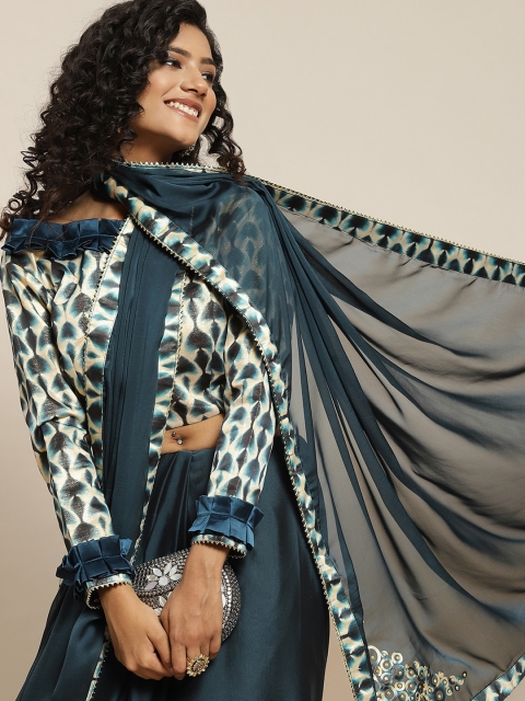 

Sangria Teal Blue Solid Printed Border Saree