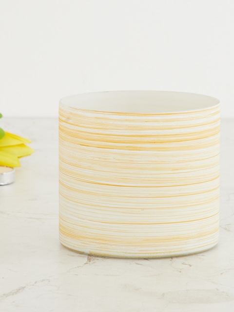 

Home Centre Yellow Textured Ceramic T-light Holder