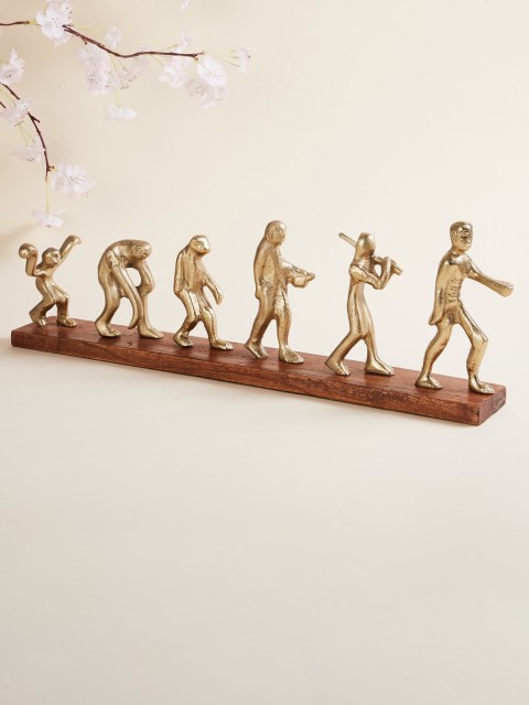 

Home Centre Gold-Toned & Brown Solid Polyresin Evolution of Man Figurine