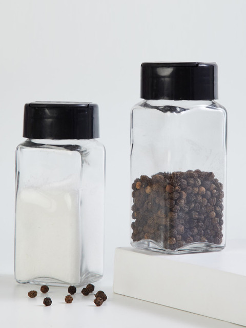 

Home Centre Set Of 2 Transparent & Black Solid Salt and Pepper Shaker