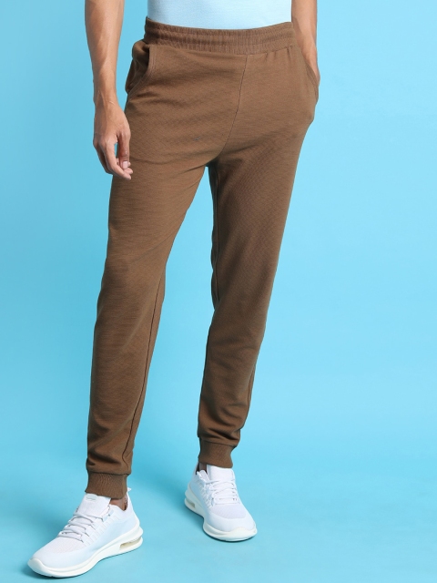 

Campus Sutra Men Brown Solid Track Pants