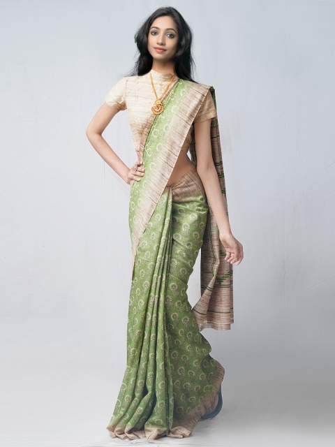 

Unnati Silks Green & White Ethnic Motifs Silk Cotton Patola Saree