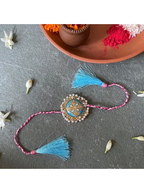 

Mitali Jain Blue Kundan Pearl Rakhi