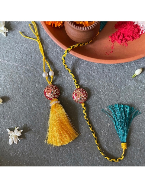

Mitali Jain Red and Yellow Tanjore Rakhi Lumba Set