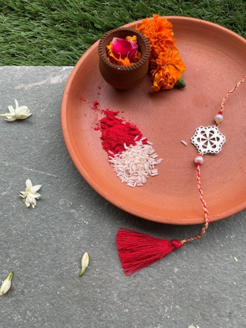 

Mitali Jain Red & Silver Toned Sterling Silver Mumtaz Rakhi