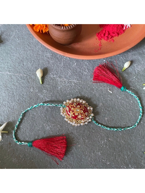 

Mitali Jain Red Kundan & Pearl Handcrafted Rakhi