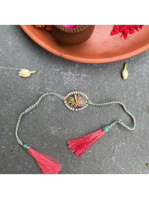 

Mitali Jain Blue Tanjore Pearl Rakhi