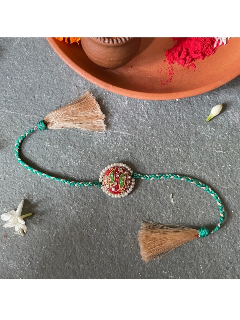 

Mitali Jain Red & Green Tanjore Pearl Beaded Rakhi