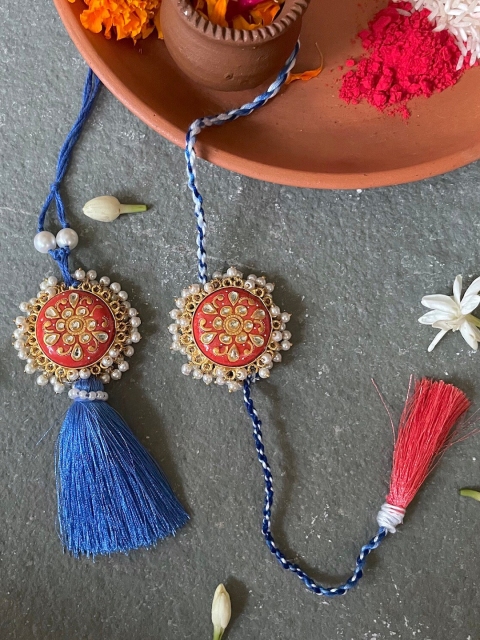 

Mitali Jain Set Of 2 Blue Kundan Pearl Rakhi Lumba Set