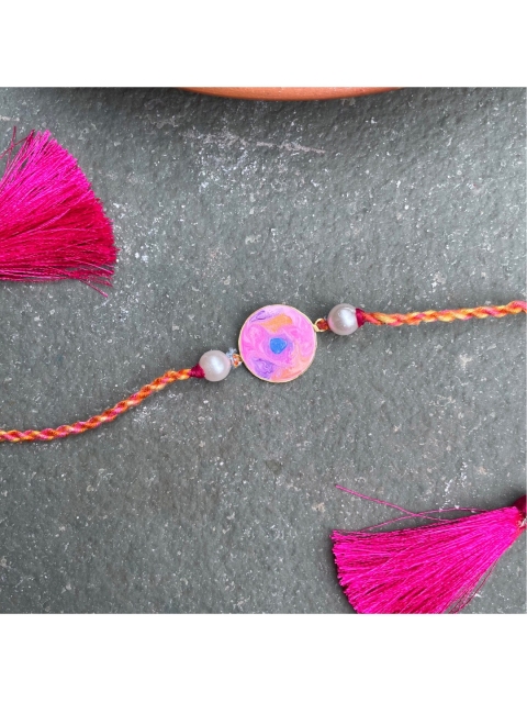 

Mitali Jain Golden & Pink 18k Gold Plated Motif Full Moon Rakhi