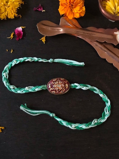 

Mitali Jain Pink & Green Tanjore Rakhi