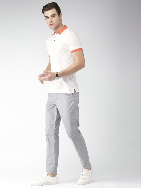 

INVICTUS Men White & Orange Printed Polo Collar T-shirt