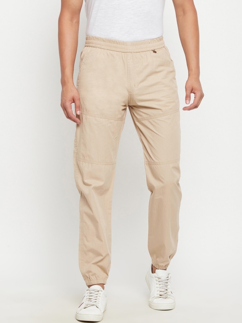 

Okane Men Cream Solid Cotton joggers