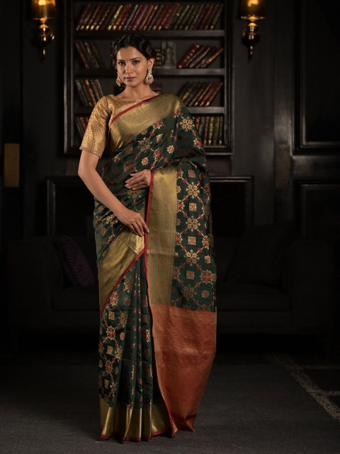 

Exclusiva Green & Maroon Patola Silk Blend Saree