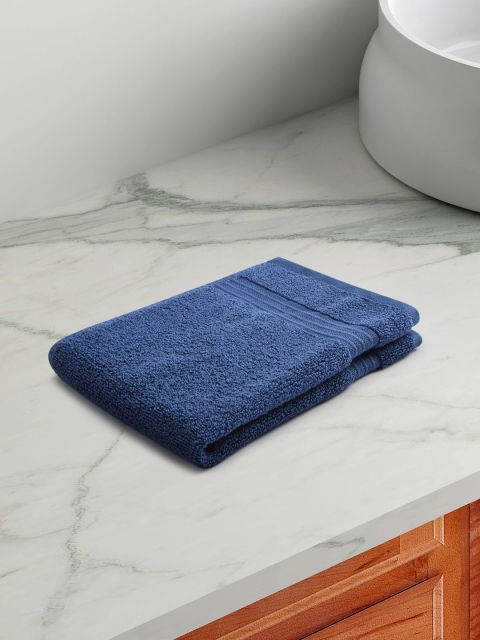 

Living scapes by Pantaloons Blue Solid 550 GSM Cotton Rectangular Hand Towels