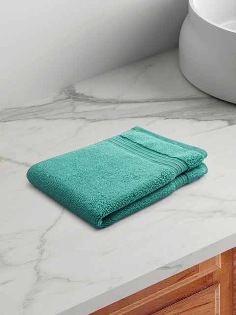 

Living scapes by Pantaloons Blue Solid 550 GSM Cotton Hand Towel
