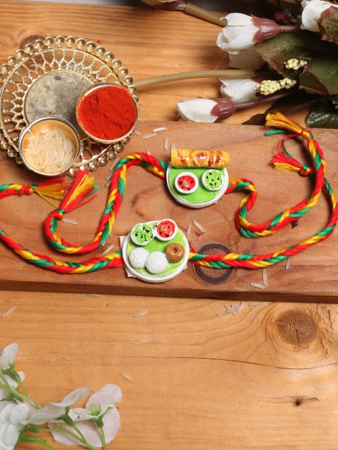

Aapno Rajasthan Set of 2 Multicoloured Idli Dosa Special Rakhi, Multi