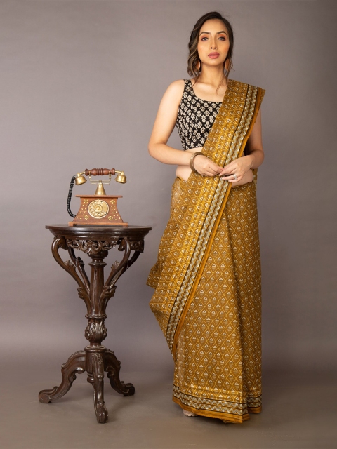 

Unnati Silks Brown & White Ethnic Motifs Pure Cotton Kovai Saree