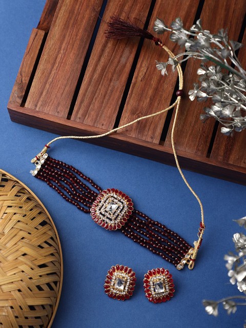 

CARDINAL Gold-Toned Red & White Kundan Studded & Beaded Jewellery Set