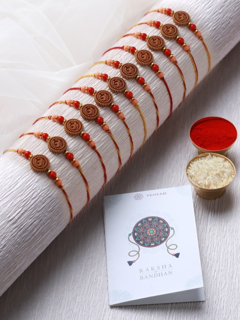 

Priyaasi Set of 10 Red Om Rakhis with Roli Chawal & Card