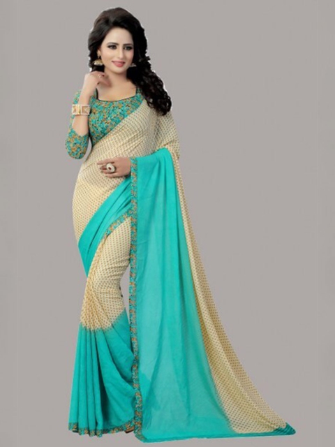 

Yashika Teal & Beige Colourblocked Saree